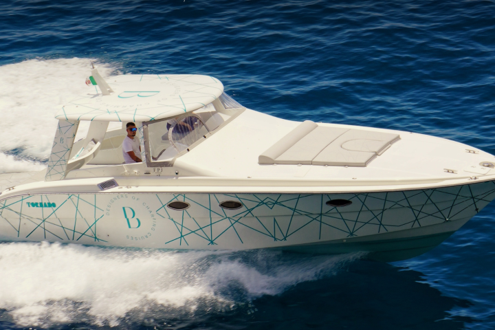 Boat cruising on blue ocean waves with text about Salerno and Amalfi Coast.